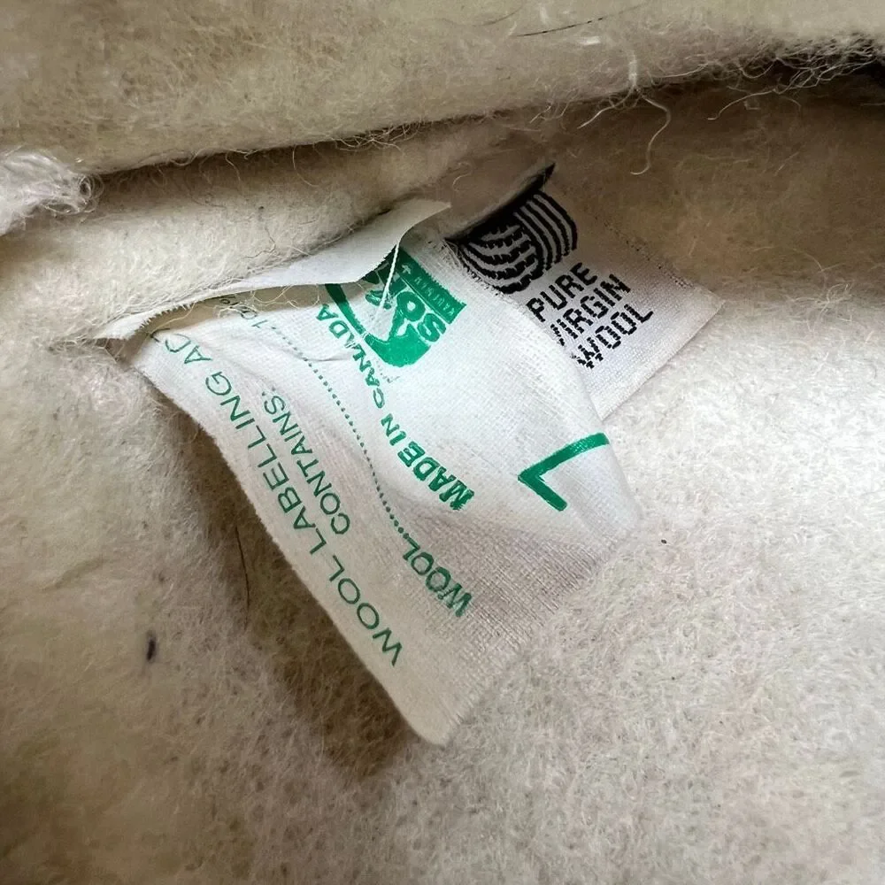 Sorel Caribou waterproof winter boots in tan leather featuring a distinctive cre